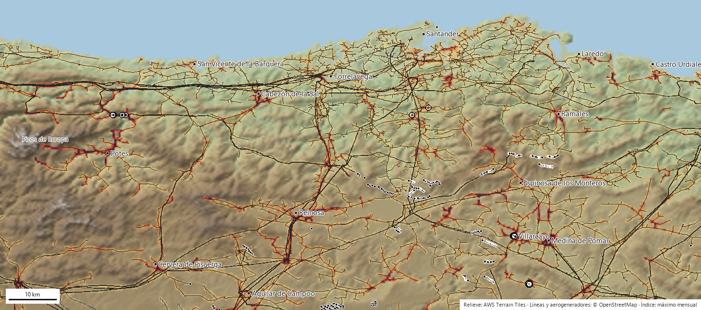Índice anual de riesgo en Cantabria: celdas coloreadas de amarillo a granate sobre un mapa de relieve sombreado con las líneas eléctricas en gris